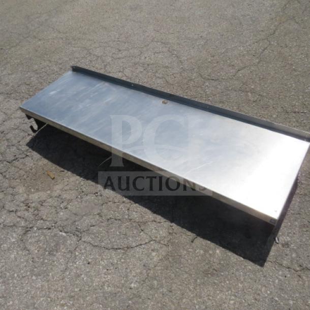 Stainless steel shelf, 60x18x10.5 inches, rectangular shape, durable construction, suitable for heavy-duty use.