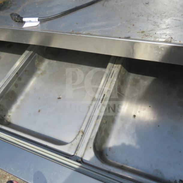 Avantco 2 Drawer Refrigerated Chef Base, stainless steel, on casters, 60x32x26 inches, 115V, shows wear, no visible labels.