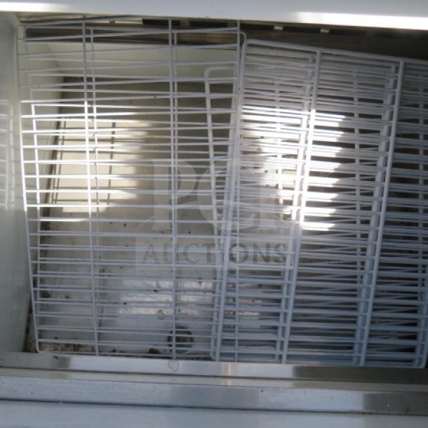 Avantco Bottle Box, Model 178GF50NC, 115 Volt, dimensions 49.5x27.5x34, interior view with metal racks, used condition.