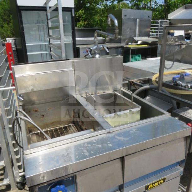 Anets Dual Natural Gas Pasta Cooker, Model GPC14, on casters. Stainless steel, 31.5x31x58 inches, used condition.