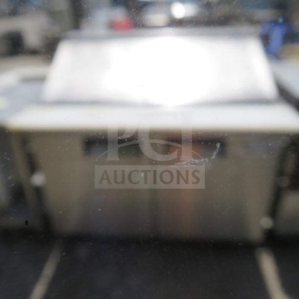 Avantco 2-door refrigerated prep table, model 178APT48MHC, with cutting board and 2 racks. Measures 47x36x46 inches.