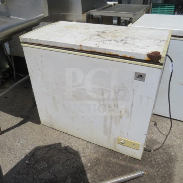 Igloo chest freezer, Model FRF710-SM-NE, 115 Volt, dimensions 37x22x33 inches, visible rust and wear, working condition.