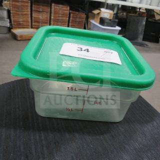 2 Quart food storage container with green lid. Marked measurements up to 1.5L. Auction label "34" visible. Good condition.