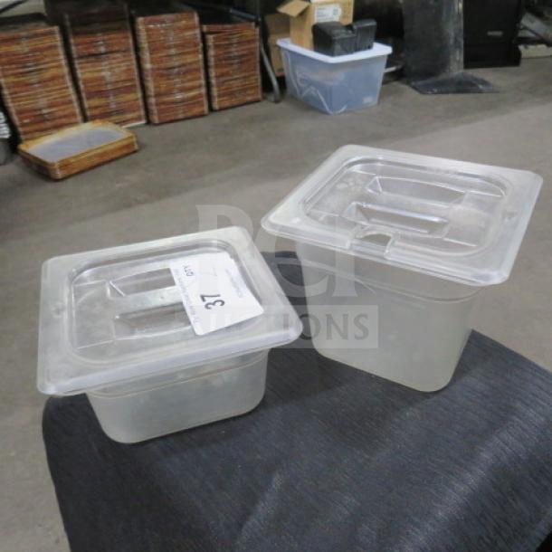 Assorted 1/6 size food storage containers with lids, clear plastic, auction tag labeled "37," used condition.