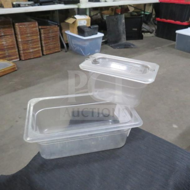 Assorted size clear food storage containers with lids, used condition, ideal for kitchen organization.