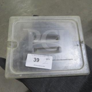 Clear 1/2 size food storage lid with two built-in handles, marked "2XBID," showing light wear. Auction tag #39 visible.