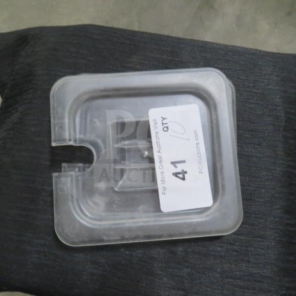 Clear 1/6 size food storage lid, transparent plastic, used condition. Marked with auction label "41".