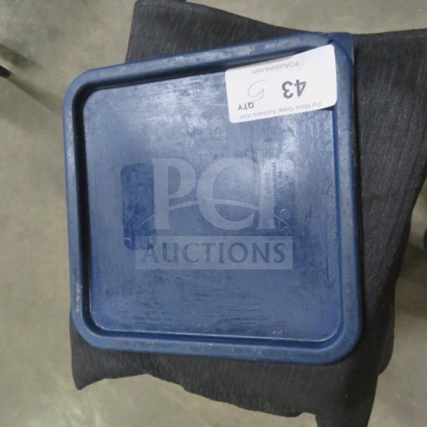 Blue 22 quart food storage lid, slightly worn, with auction label "43 QTY" attached.