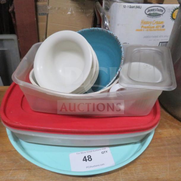 Miscellaneous lot of kitchenware including bowls, lids, and containers. Various sizes and colors. Used condition, item tag number 48.