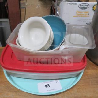 Miscellaneous lot of kitchenware including bowls, lids, and containers. Various sizes and colors. Used condition, item tag number 48.