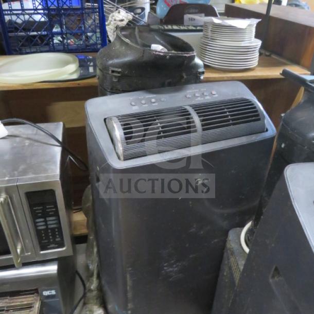 Midea Portable Air Conditioner, Model MAP12S1TGR-S, 115 Volt, used condition. Visible control panel and air vents.