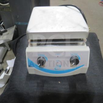 One Top Line Lab hot plate, white, dual dials, used condition, power and heat settings visible.