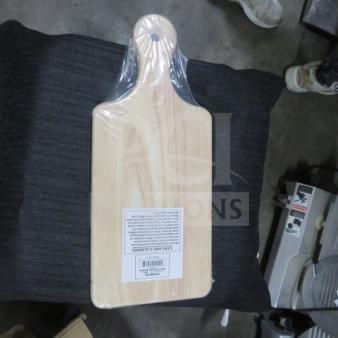 New wood bread board, model 6XBID, sealed in plastic. Rectangular with handle. Care instructions and barcode label visible.