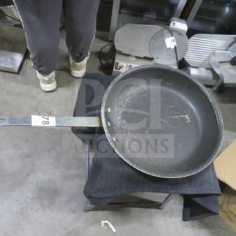 Superior 12-inch sauté pan with long handle, showing signs of use with visible surface scratches.
