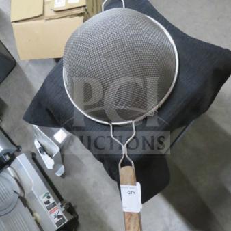 Mesh strainer with metal frame, wooden handle, and fine mesh netting. Tag reads "QTY." Appears in good condition.