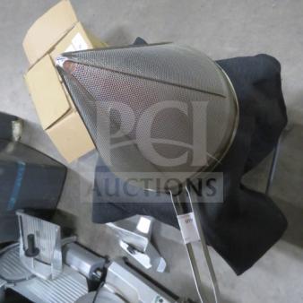 Stainless steel cone strainer with fine mesh, long handle, and sturdy construction, in excellent condition.
