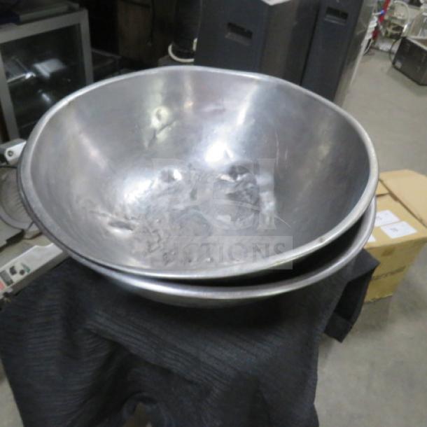 16 Inch stainless steel mixing bowl, slightly used, minor surface wear, suitable for kitchen or commercial use.