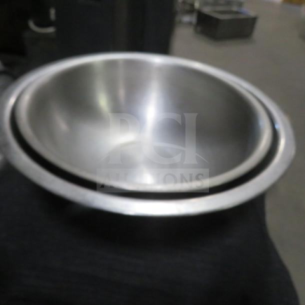 Assorted size stainless steel mixing bowl, durable construction, slightly reflective finish, shown in good condition.