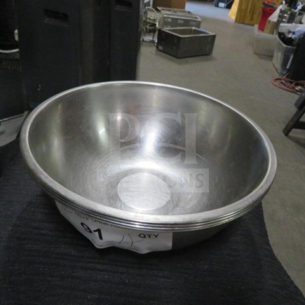10-inch stainless steel mixing bowl with a shiny finish, minor surface scratches. Label indicates quantity: 1.