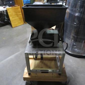 Ssbrewtech grain mill on a sturdy metal and wood base. Features a hopper for grain. Good condition, ideal for homebrewing.