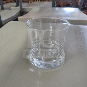 Clear glass Rocks Glass 12XBID with a sturdy base and gently flared rim, in excellent condition.