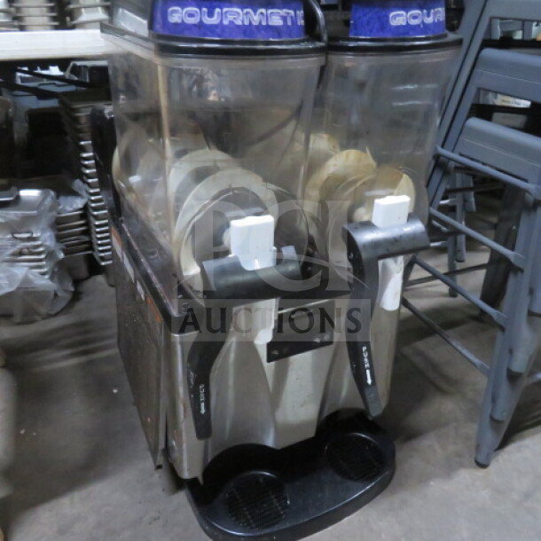 Bunn ULTRA-2 Gourmet Slushie Machine, dual dispensers, 120V, used condition, marked "Gourmet" on top, stainless steel body.