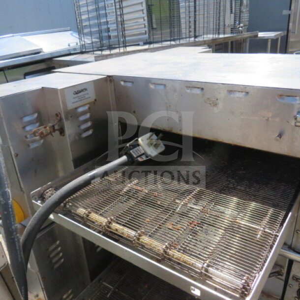 Ovention countertop electric conveyor oven, 46x37x16.5 inches, stainless steel, working condition, power cord visible.