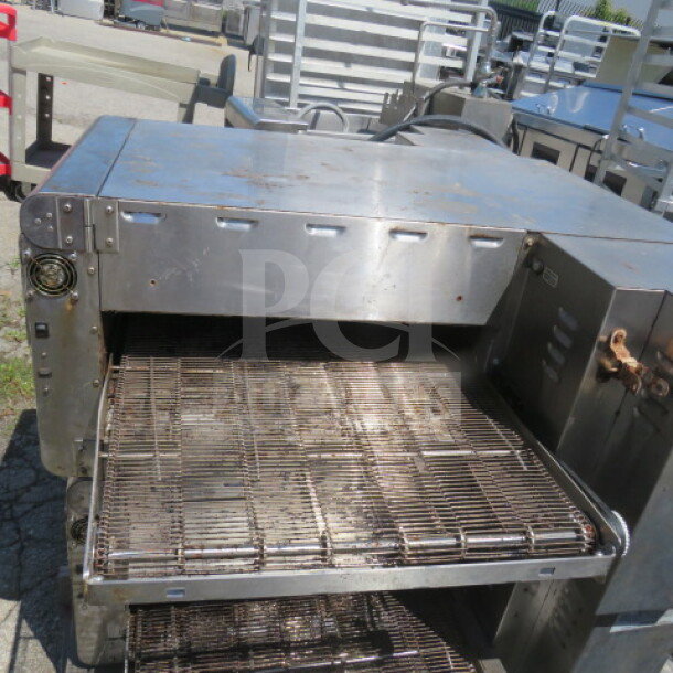Ovention countertop electric conveyor oven, 46x37x16.5, stainless steel, working condition, visible wear.