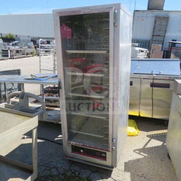 Carter Hoffman Heat and Hold HL3-18-33 on casters, 120V, 26.5x31x70.5 inches. Stainless steel, used condition, visible controls.