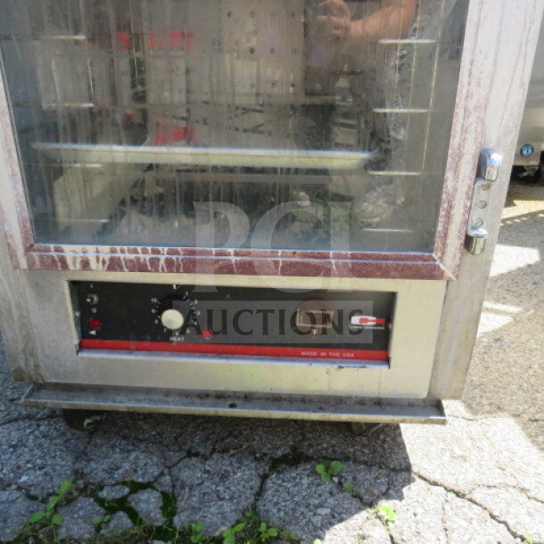 Carter Hoffman Heat and Hold Cabinet, Model HL3-18-33, 120V, on casters, 26.5x31x70.5, visible controls, used condition.