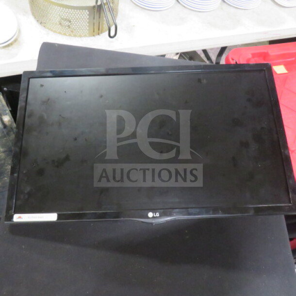 LG Flatscreen Monitor 23MP57HQ-P, sleek design, used condition, minor surface wear, features HDMI and VGA ports.