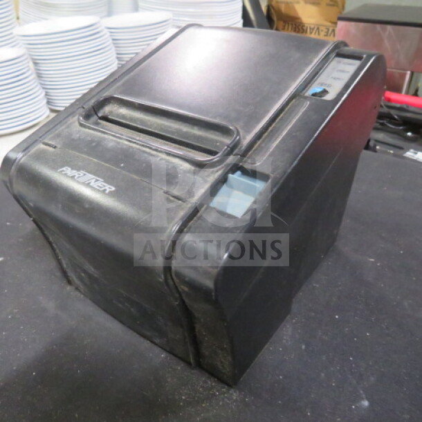 Partner RP-300-H thermal printer, black, used condition. Features front-loading design. Model and brand labels visible.