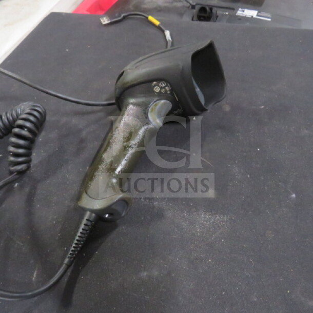 Honeywell Handheld Scanner 1900, black, coiled cord, used condition, USB connection visible.