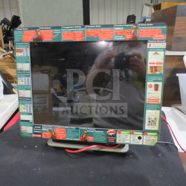 Partech POS Touchscreen Terminal T8115, with visible setup labels, reflective surface, and red connecting cables.