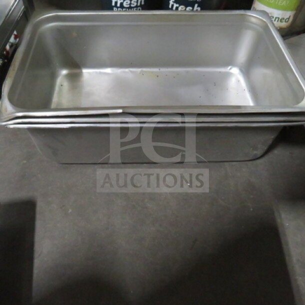 Full-size 4-inch deep hotel pan with lid, stainless steel, lightly used, durable for catering or kitchen use. 2XBID.