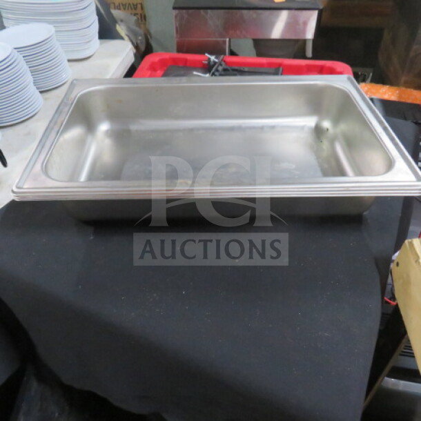Full-size 2.5-inch deep hotel pan with lid, stainless steel, gently used condition, ideal for catering and food service.