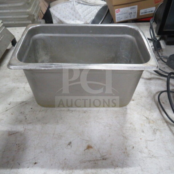 1/4 Size 6 Inch Deep Hotel Pan, stainless steel, used condition, suitable for kitchen or catering use.