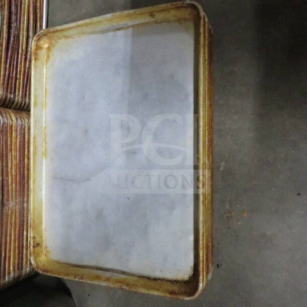 1/4 size sheet pan with visible wear and rust on edges. Model 9XBID. Suitable for baking, good condition for use.