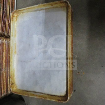 1/4 size sheet pan with visible wear and rust on edges. Model 9XBID. Suitable for baking, good condition for use.