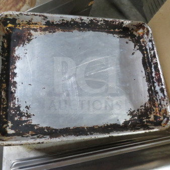 Lot of approximately 30 half-size sheet pans, well-used, showing signs of wear and discoloration.