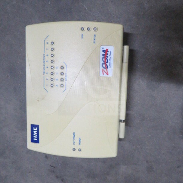 HME BASE 6200 intercom system. Features power LEDs, status indicators, and ZOOM communication label. Appears in good condition.