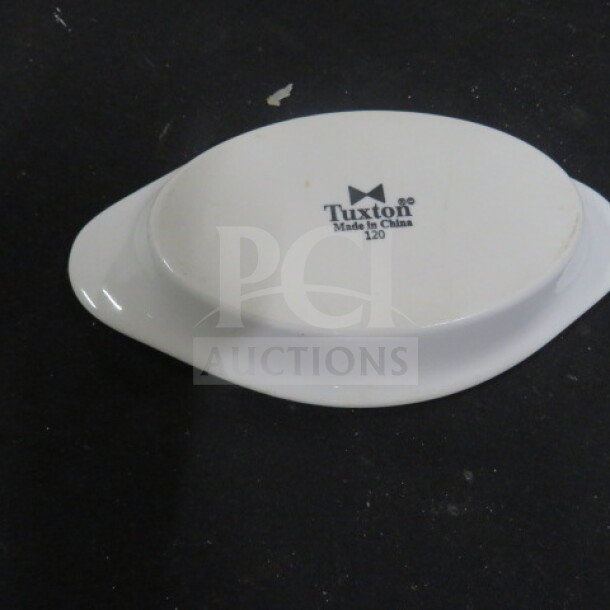 Tuxton 120 Welsh Rare Bit Server, white ceramic, 8x4.5 inches. "Tuxton Made in China 120" imprint on base. Auction Lot: 10XBID.