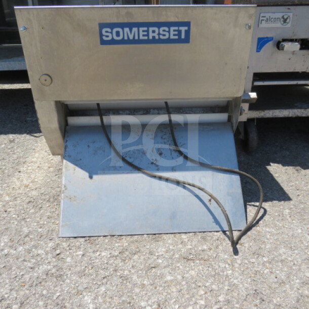 Somerset Dough Roller CDR-2000, 120V, 22.5"x30"x21.5". Features a durable metal frame. Model and brand labels visible.