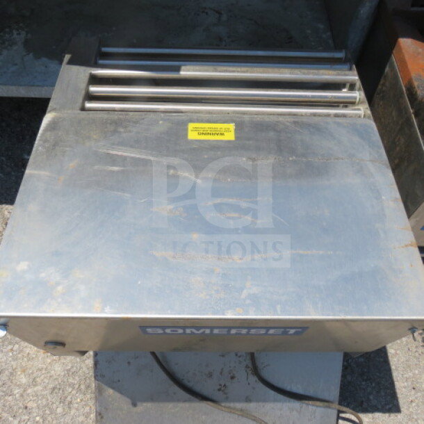 Somerset CDR-2000 dough roller, 120 volt, 22.5x30x21.5 inches. Stainless steel, visible surface wear, Somerset logo on front.