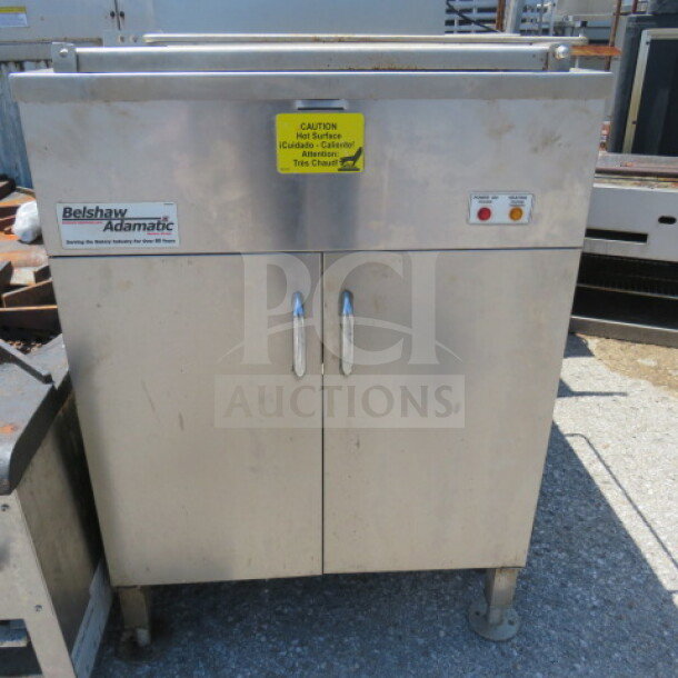 Belshaw Adamatic Donut Fryer, stainless steel, 25.5x33.5x63.5 inches, caution label, used condition.