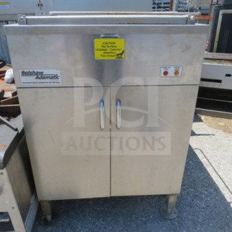 Belshaw Adamatic Donut Fryer, stainless steel, 25.5x33.5x63.5 inches, caution label, used condition.
