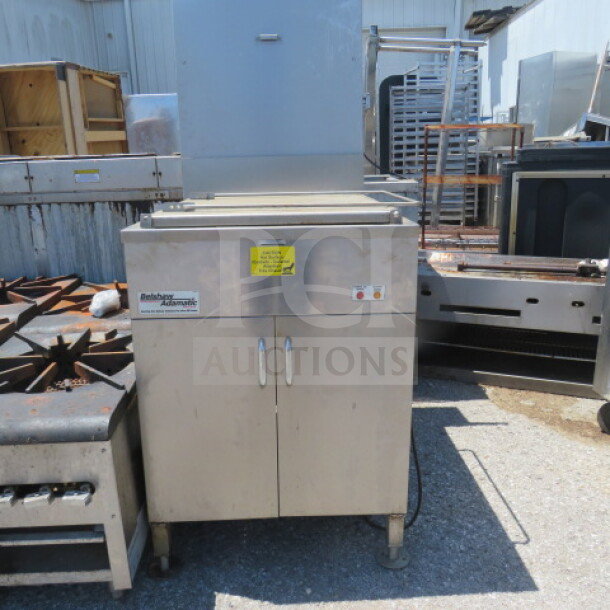 Belshaw Adamatic donut fryer, stainless steel, measures 25.5x33.5x63.5 inches, used condition, visible control panel.