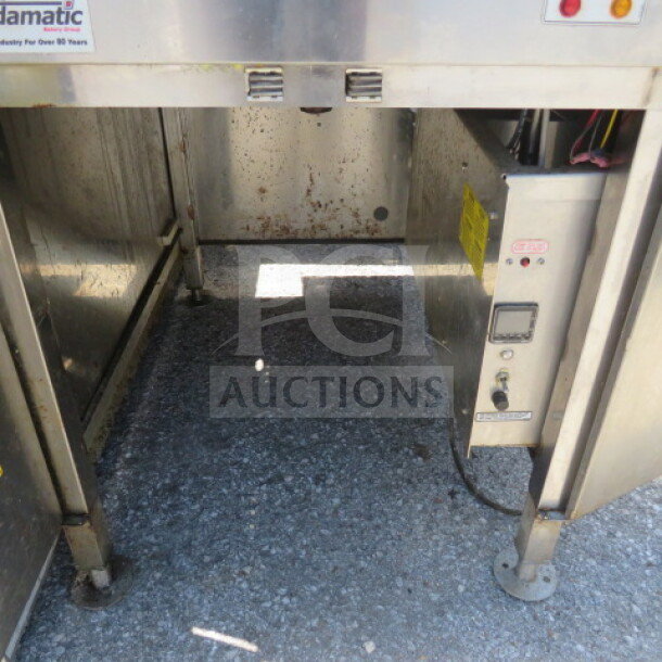 Belshaw Adamatic donut fryer, 25.5x33.5x63.5 inches, stainless steel, visible wear, control panel with indicators, auction item.