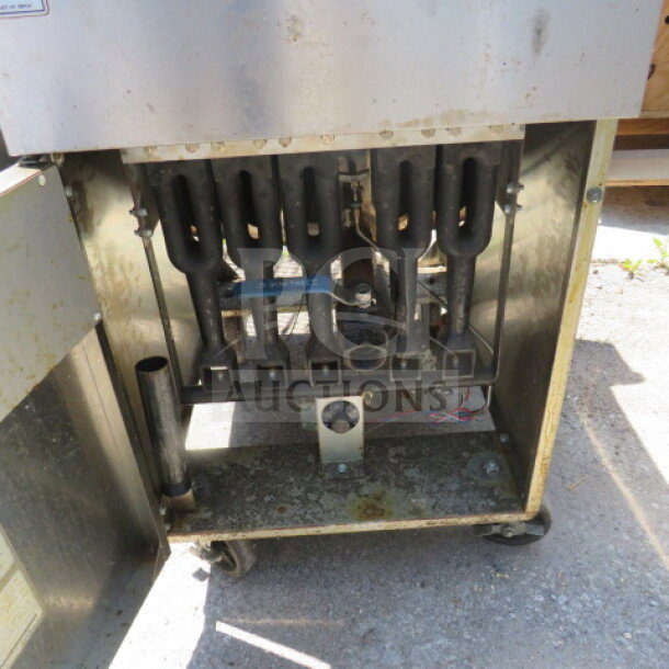 Cook Rite natural gas deep fryer, model ATFS-75, on casters, open door view showing internal gas burners, 21x31x45 inches.