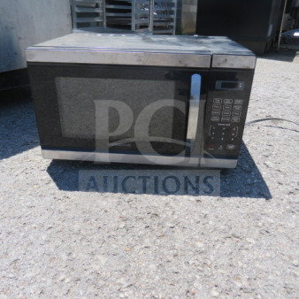 Faberware Microwave, Model FM011AHTBKM, 120V, 20.5x14.5x12, black and silver, visible control panel, fair condition.